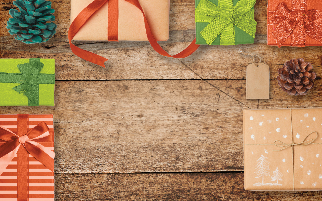 Wood background with colored holiday presents